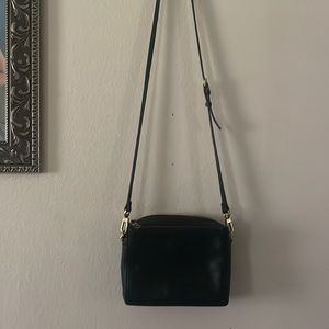 Fossil black purse with adjustable length strap